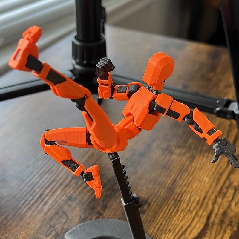 Orange 3D-printad robotfigur i pose
