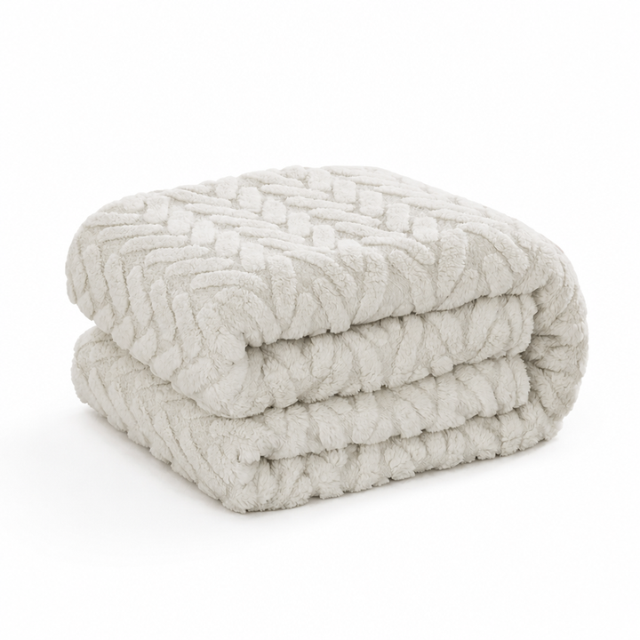 Vändbar fleecefilt i jacquard – en slät och en fluffig sida