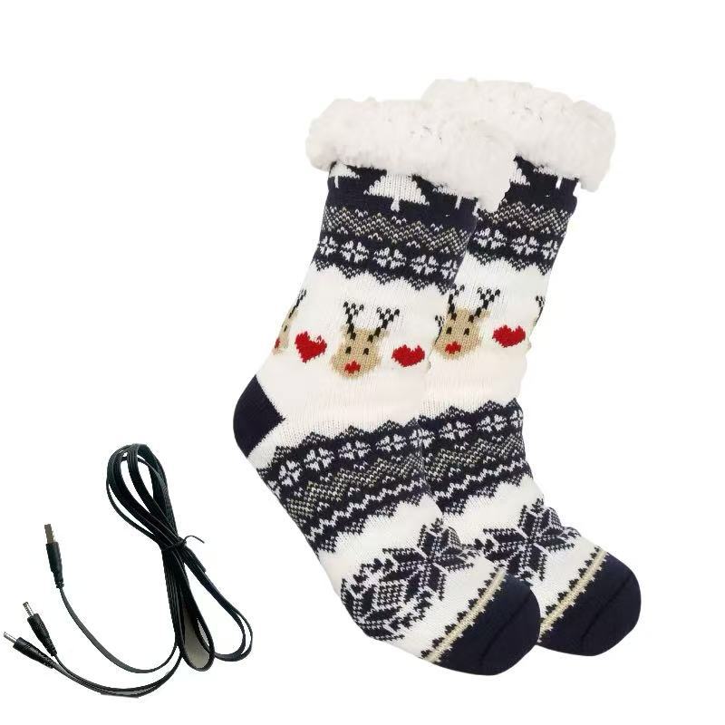 Stickade julsockor med renmönster och USB-kabel