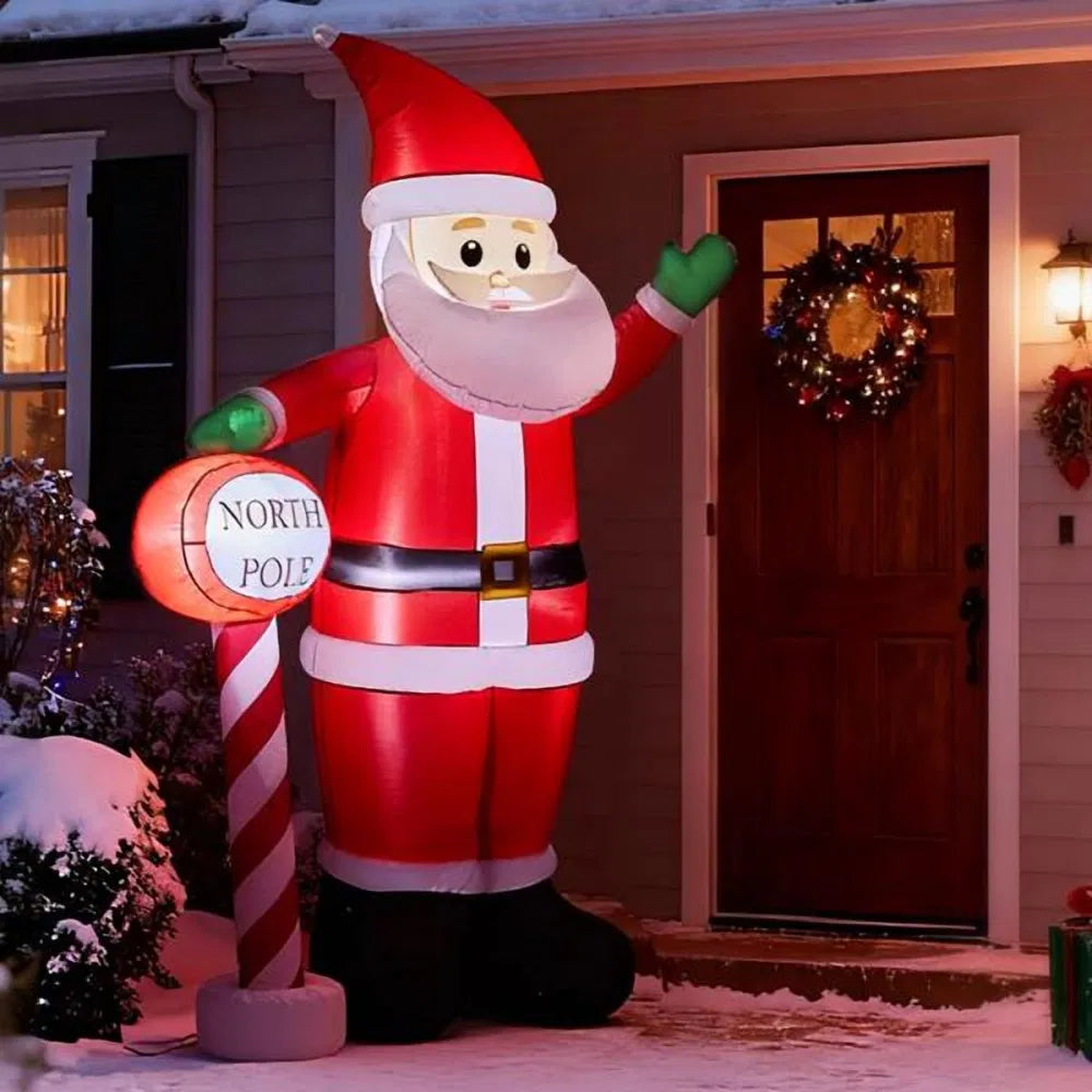 Stor uppblåsbar tomte som vinkar