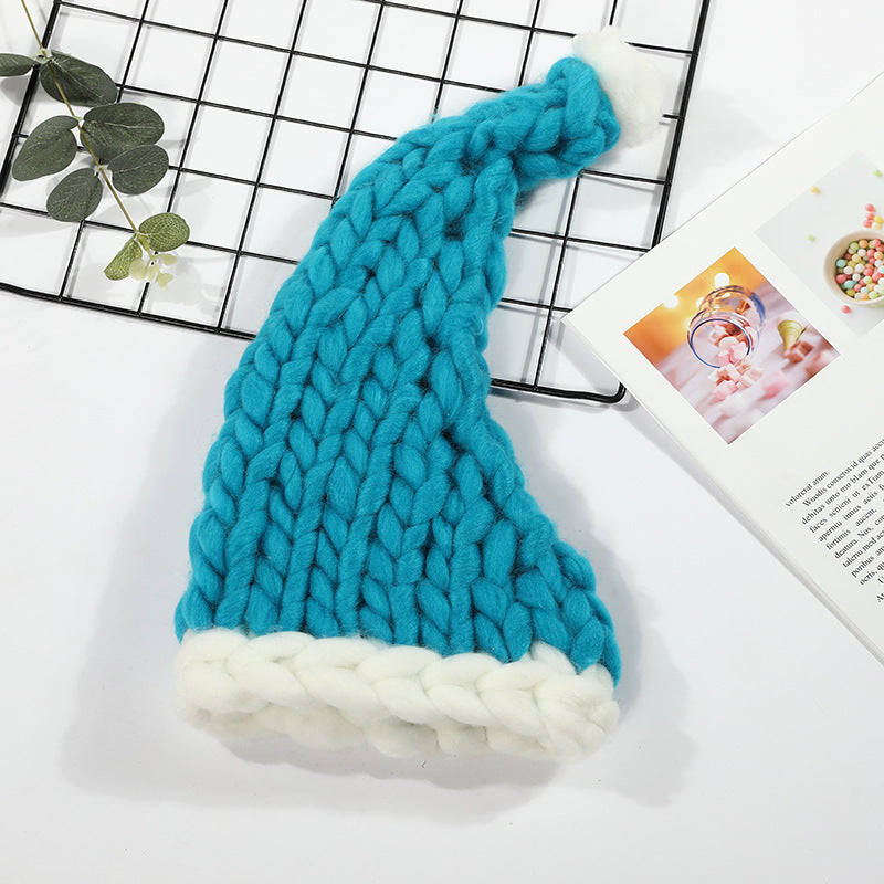 Grovstickad röd tomteluva med pompom