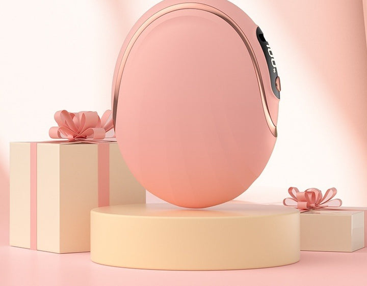 Rosa äggformad handvärmare med display