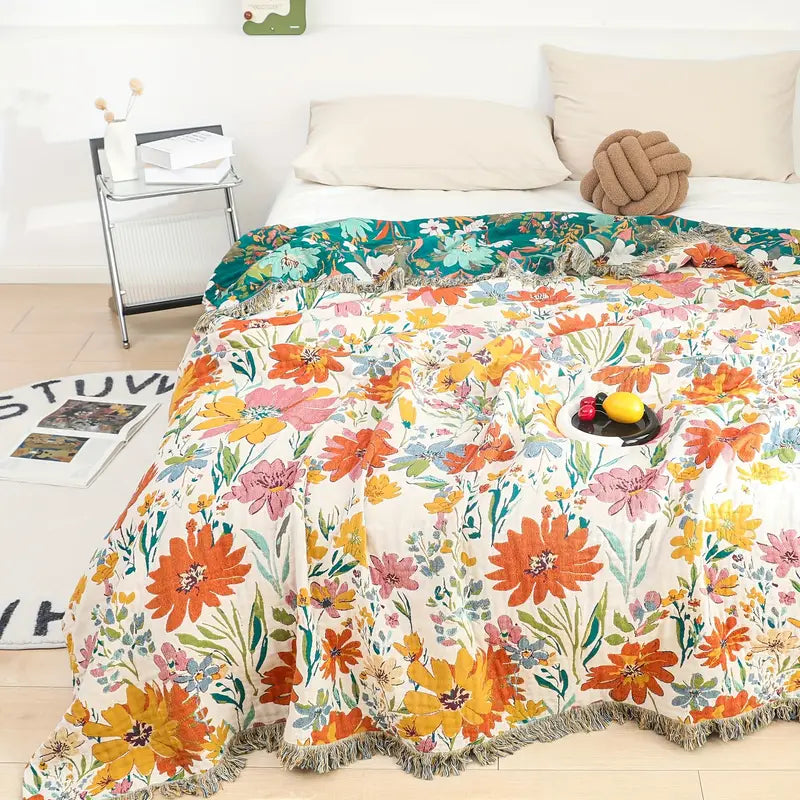 Bomullsfilt i jacquard med ängsblommor för alla årstider