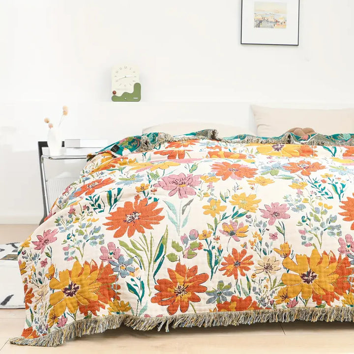 Bomullsfilt i jacquard med ängsblommor för alla årstider