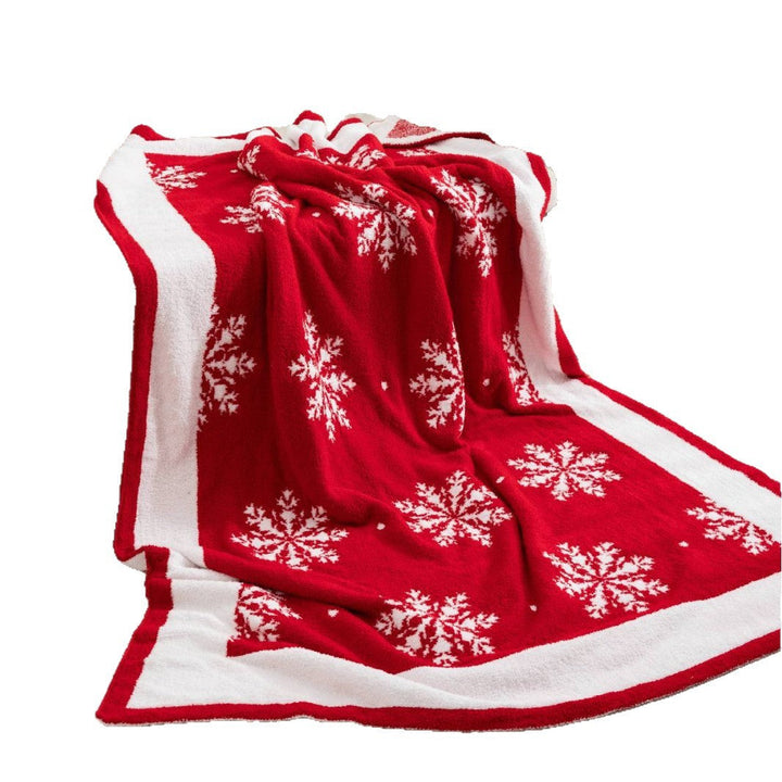 Pläd med snöflingor för en mysig och festlig jul
