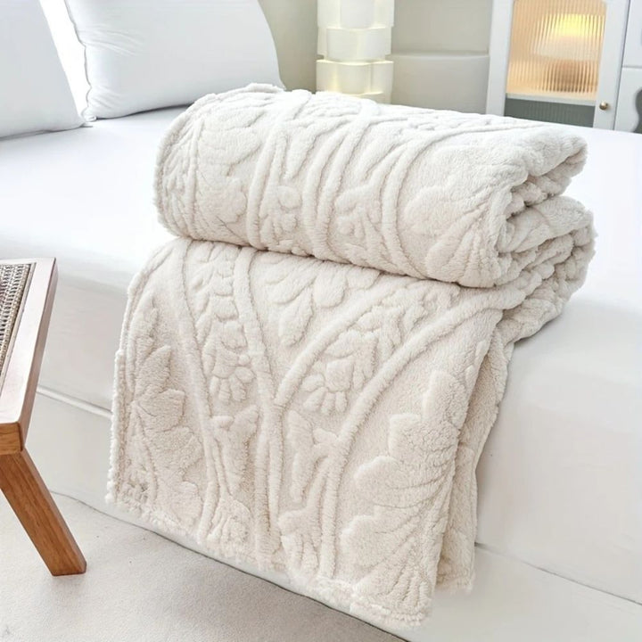 Fleecepläd i jacquard med geometrisk struktur i fyra storlekar