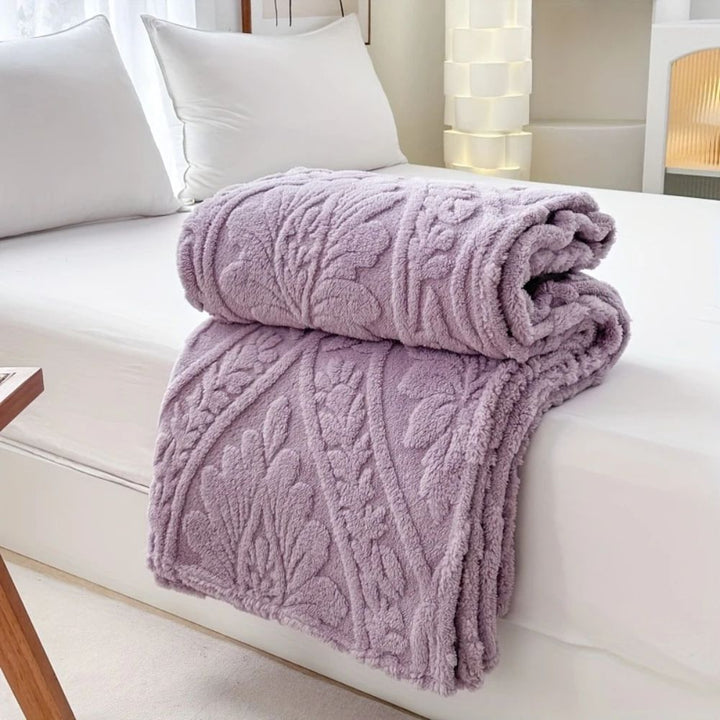 Fleecepläd i jacquard med geometrisk struktur i fyra storlekar