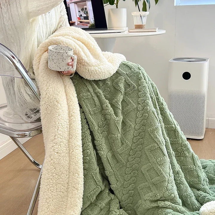 Vändbar sherpafilt i fleece som värmer utan att tynga