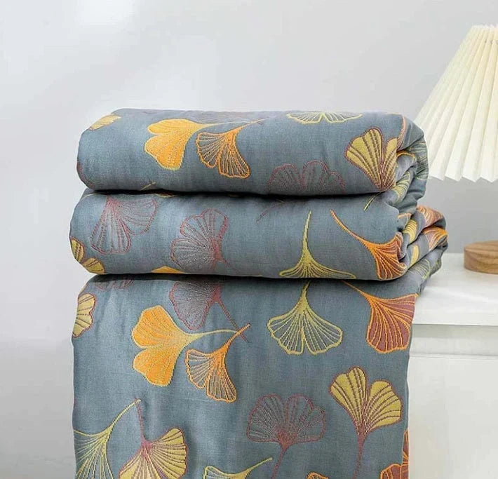 Vändbar pläd med elegant mönster av ginkgoblad