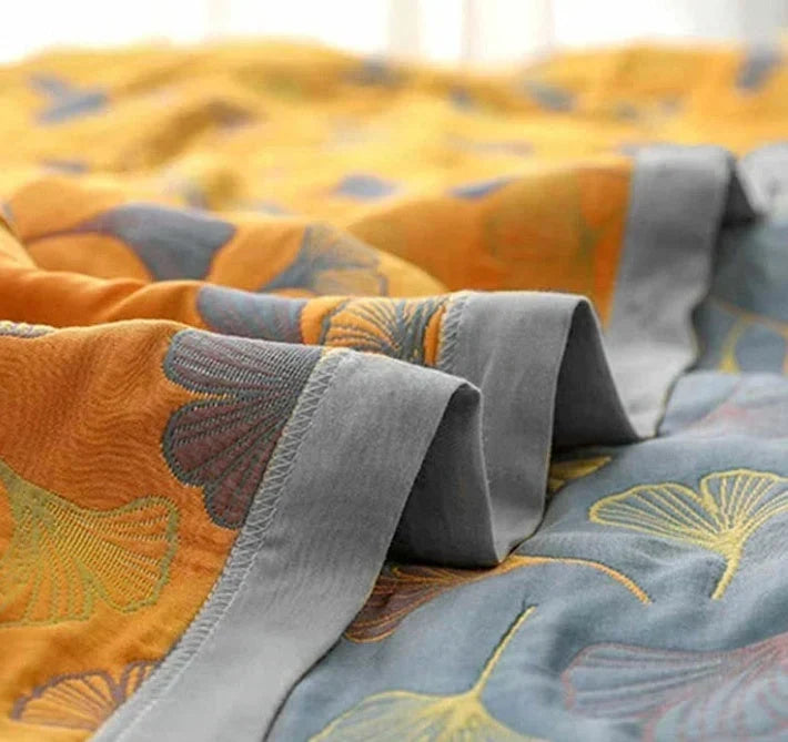 Vändbar pläd med elegant mönster av ginkgoblad