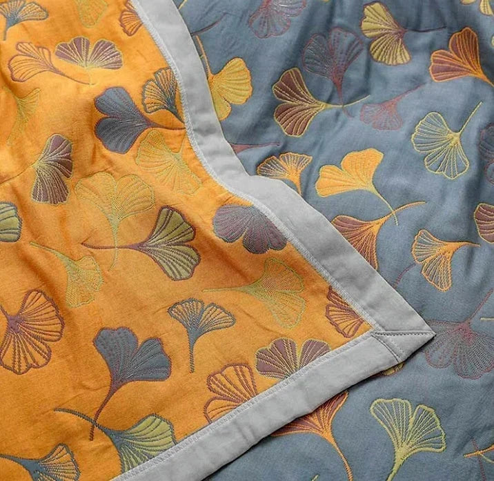Vändbar pläd med elegant mönster av ginkgoblad