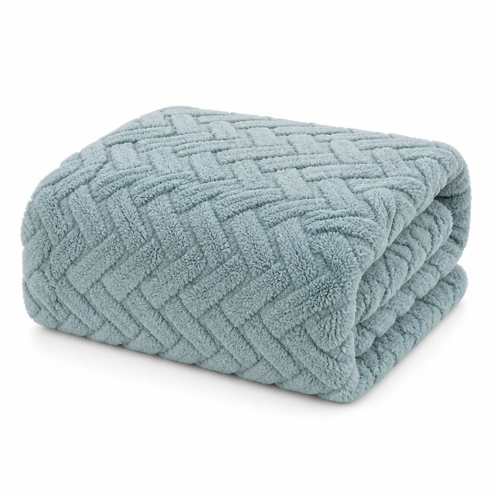 Vändbar fleecefilt i jacquard – en slät och en fluffig sida